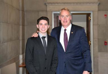 Secretary Ryan Zinke congratulating Desmond Herzfelder on his dedicated efforts to advocate for the mural to be celebrated