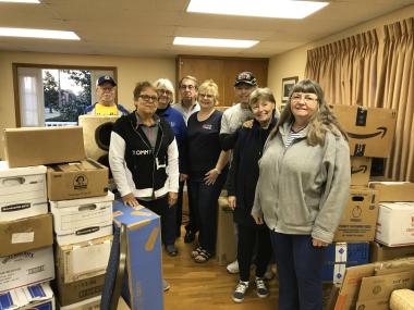 Francis Vigo Chapter loaded 143 boxes of school supplied onto a truck traveling to Tamassee and Crossnore DAR Schools