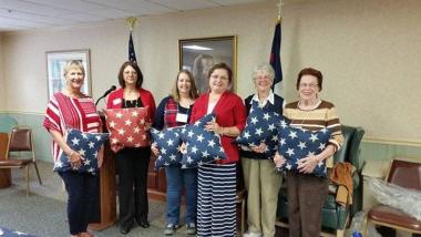 Fort Augusta Chapter, PA volunteered at their local assisted living facility by presenting pillows to veteran residents and thanked them for their service