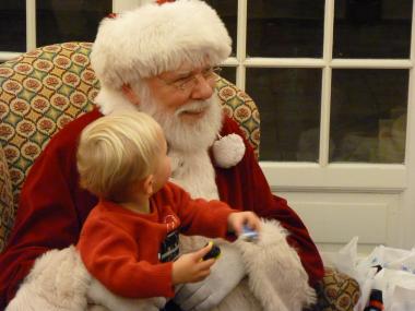 Santa stopped by the Open House to hear requests from young visitors.
