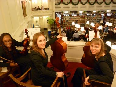Holiday music is provided by this high school orchestra group in the DAR Library.