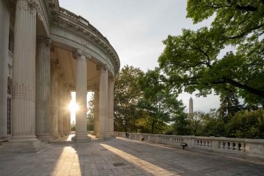 Columns of a building illuminated by sunlight.
