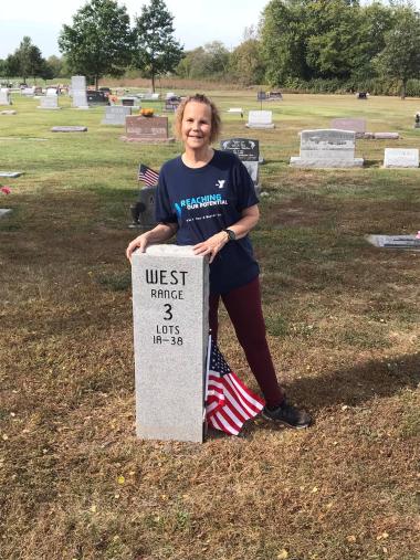 The Where The Trail Divides Chapter placed flags on graves at their local cemetery.