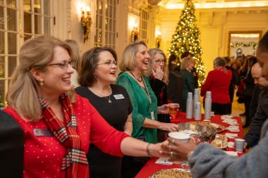 Property Beautification and Hospitality Committee hand out refreshments to Open House attendees. 