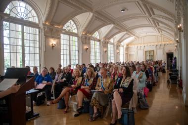 Women seated listening to a presentation 