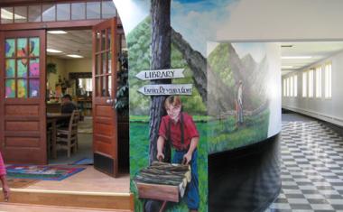 The Hindman Settlement School, in Hindman, KY was awarded an education grant to support their Folk Arts Education Program and the Visiting Artists Series. Jesse Ray Sims, artist-illustrator, teaches students and teachers the vital connections between science, math, and art, which help to unlock the students creativity. He worked closely with 10 students to paint this mural with scenes from traditional Appalachian Jack Tales.