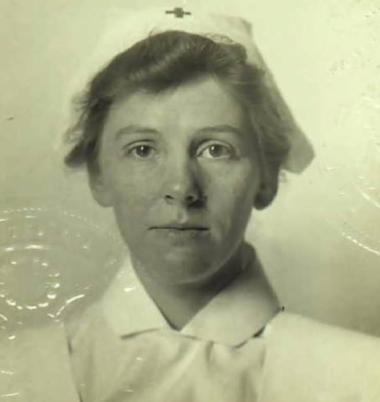  This is the 1917 passport photo of Edward Buncombe Chapter member Anne Penland. Anne Penland of Asheville, NC, was the first graduate of the nurse anesthetist school at Columbia Presbyterian Hospital in New York in 1914, volunteered through the Red Cross to serve in WWI, and sailed for London on May 14, 1917, on the St. Louis, with a group of about 65 doctors, nurses, anesthetists and orderlies from Columbia Presbyterian. She became the first nurse anesthetist to serve on the front lines in France and was 