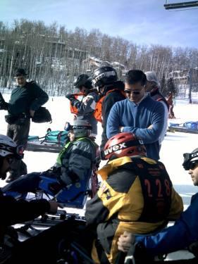 General Eric Shinseki, Secretary of Veterans Affairs (standing) visits with participants as they get ready to ski.